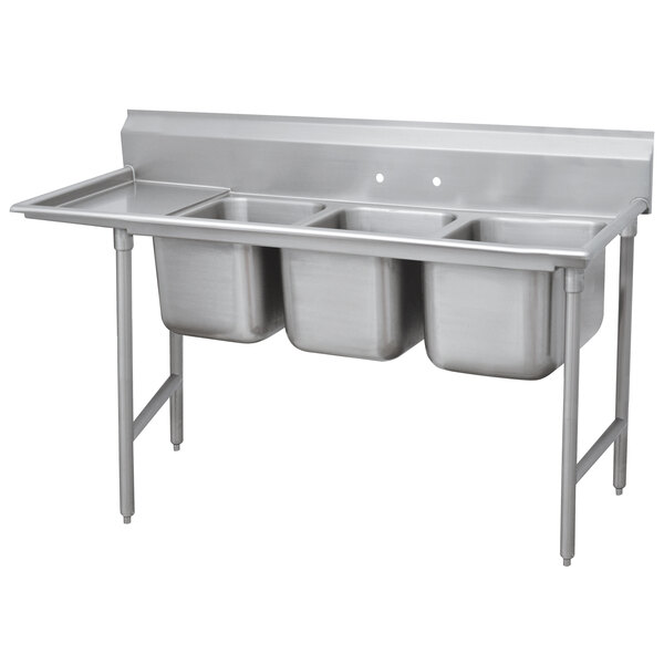 A stainless steel Advance Tabco three compartment sink with left drainboard.