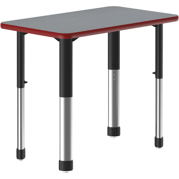 A grey rectangular Correll table with a red border and black legs.