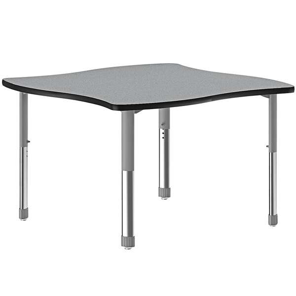 A rectangular gray Correll collaborative desk with gray legs and a black band.