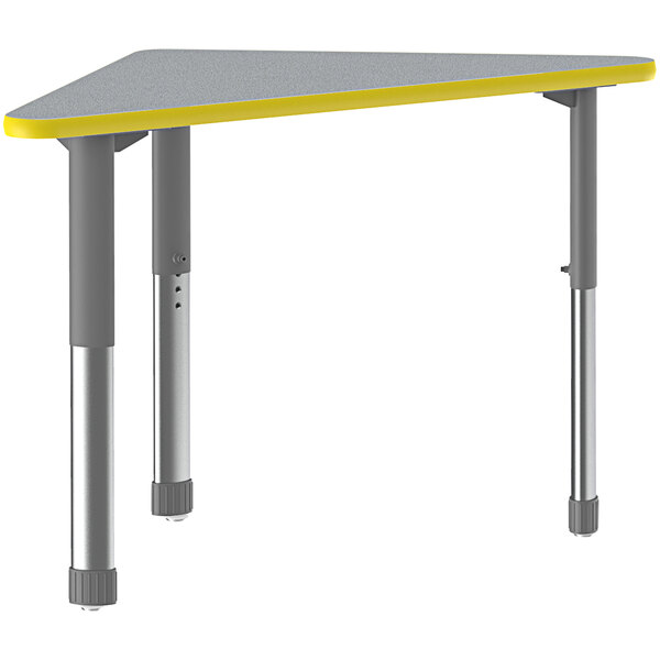 A grey and yellow triangular Correll collaborative desk with grey legs.