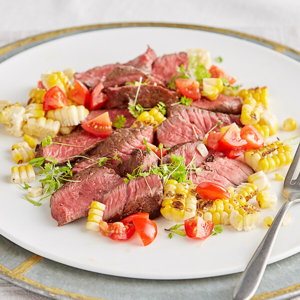 A plate with a TenderBison sirloin steak and corn.