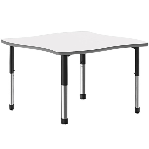 A white rectangular Correll collaborative desk with a black base.