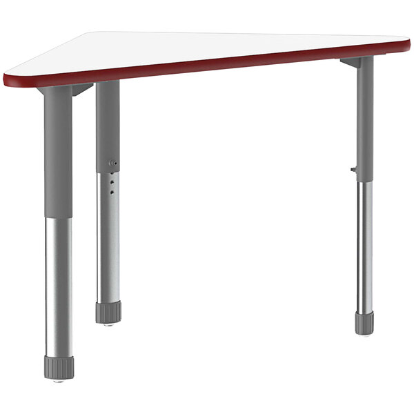 A white triangular table with a red top and metal legs.