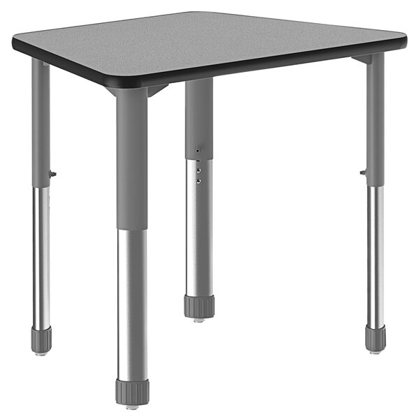 A trapezoid gray granite Correll collaborative desk with gray metal legs and a black band.
