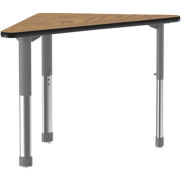 A Correll triangular table with oak legs and a black band on the edge.