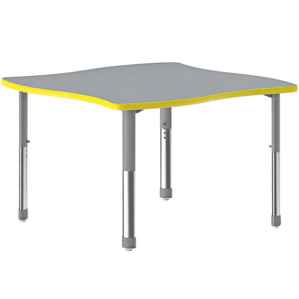 A gray and yellow Correll swerve table with a gray top.