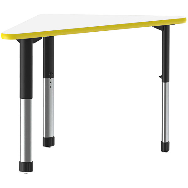 A white triangular Correll desk with a yellow band and black legs.