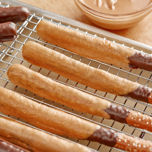A tray of pretzels dipped in Regal Foods Simply Caramel Coating.