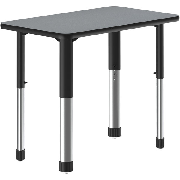 A grey rectangular Correll collaborative desk with a black band and black adjustable legs.