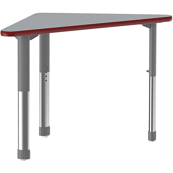 A triangular gray and red Correll collaborative desk with gray metal legs.