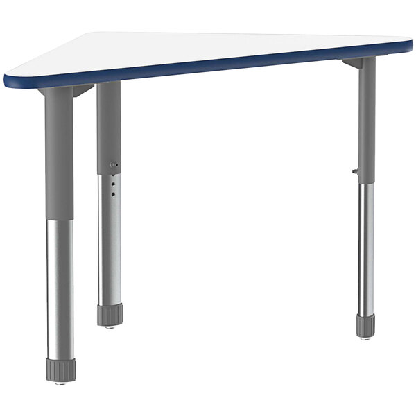 A triangular white Correll desk with metal legs.