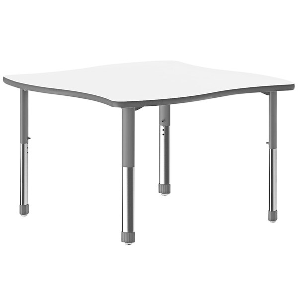 A Correll white rectangular desk with gray legs.
