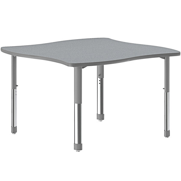 A grey rectangular Correll collaborative desk with grey legs.