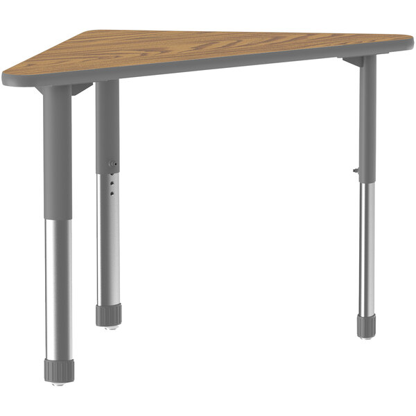 A triangular Correll medium oak table with metal legs.