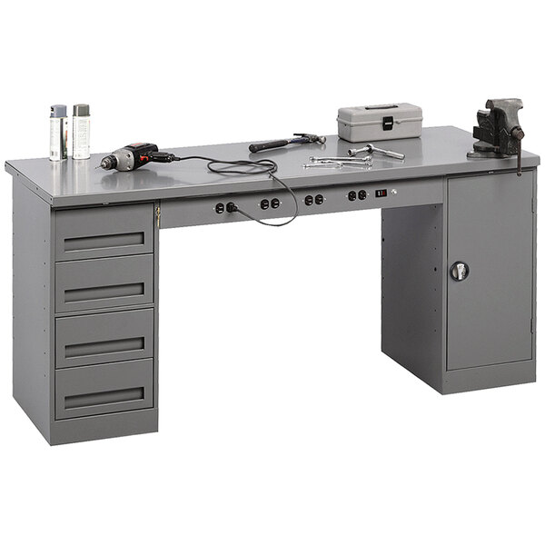 A grey Tennsco steel workbench with a cabinet and drawers with tools on it.