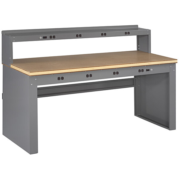A grey workbench with a wood top and riser panel legs.