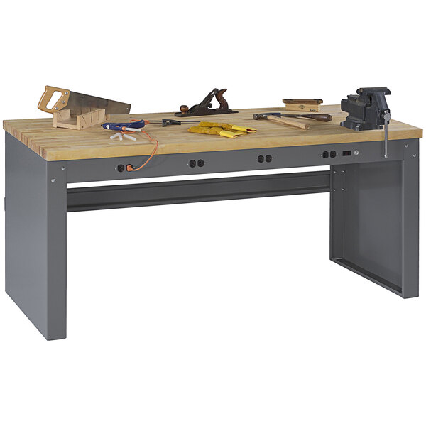A Tennsco workbench with tools on it.