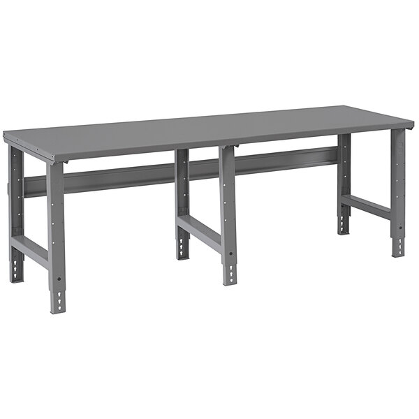 A grey rectangular Tennsco steel workbench with metal legs.
