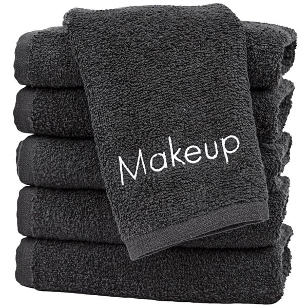 A stack of Monarch Brands black makeup wash cloths.