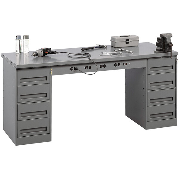 A grey Tennsco steel workbench with tools on it.