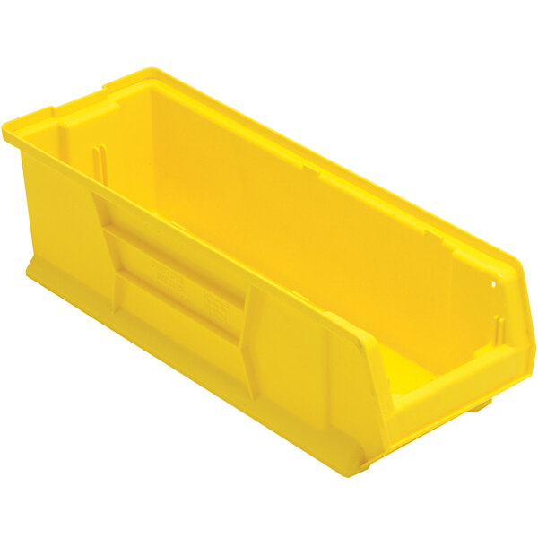 A Quantum yellow plastic storage bin with a lid.