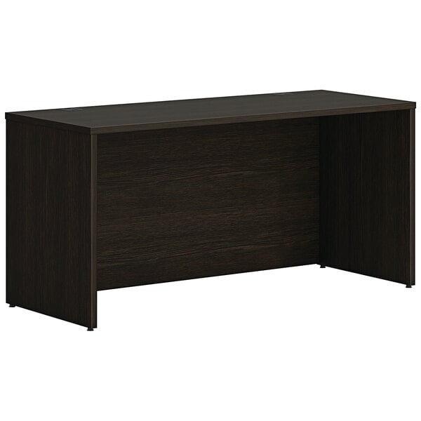 A black HON credenza shell with a dark wood top.