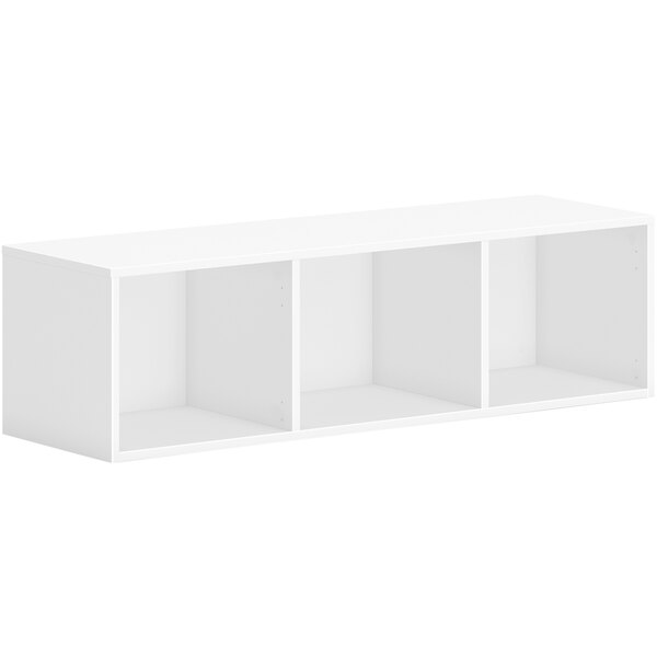 A white rectangular wall-mounted storage cabinet with three shelves.
