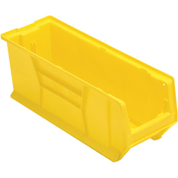 A Quantum yellow plastic bin with a handle.