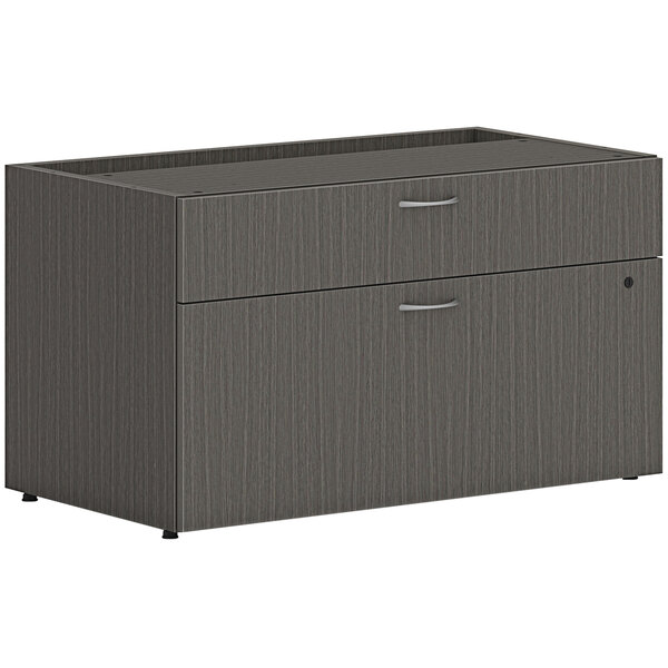 A slate grey cabinet with two drawers.