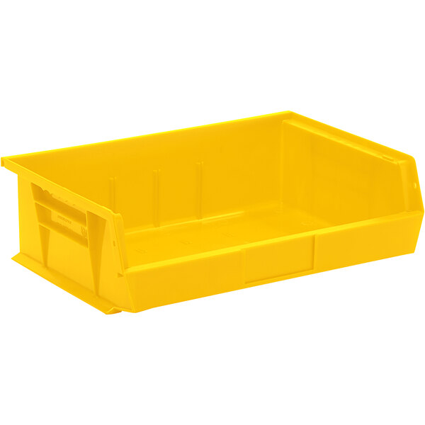 A yellow plastic Quantum storage bin with handles.