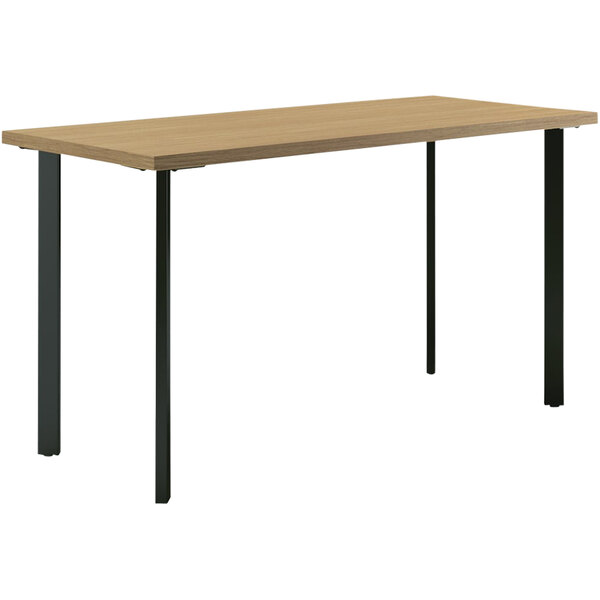 A HON rectangular desk with a natural recon wood top and black legs.