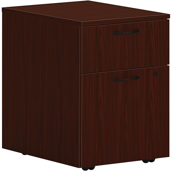A traditional mahogany HON mobile pedestal file cabinet with 1 file drawer.