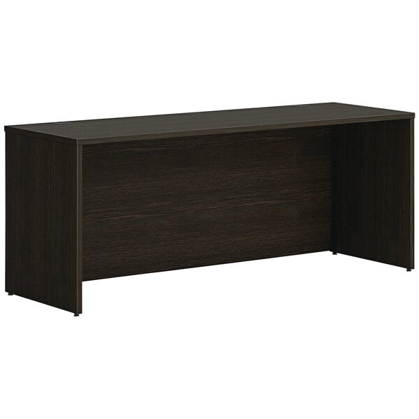 A dark brown HON Mod credenza shell with a dark wood top.
