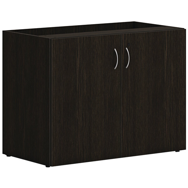 A Java oak storage cabinet with two doors.
