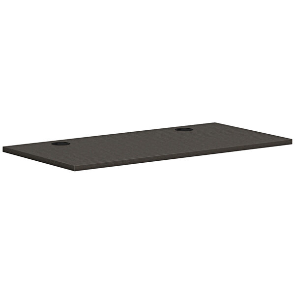 A rectangular slate teak worksurface with two holes in a white background.
