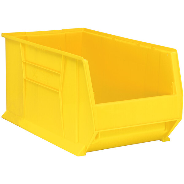 A Quantum yellow plastic storage bin with a lid.