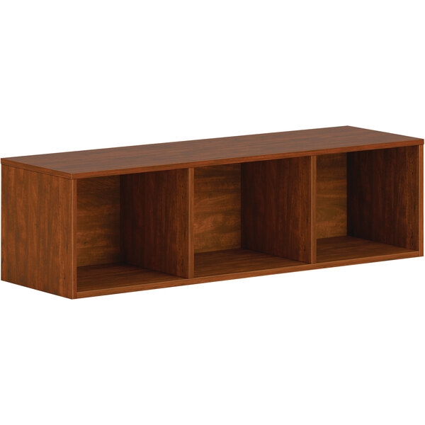 A russet cherry wall mounted laminate open storage cabinet with open shelves.