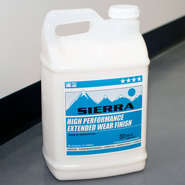 A white jug of Sierra by Noble Chemical high performance floor finish with a blue label.