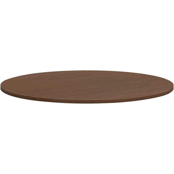A round brown HON conference table top.