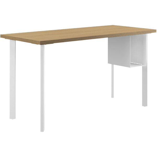 A wooden HON desk with a white surface and U-shaped storage.
