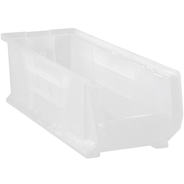 A Quantum clear plastic bin with a handle.