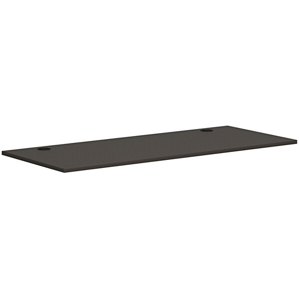 A slate rectangular worksurface with two rectangular holes.