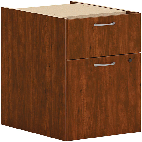 A HON russet cherry hanging pedestal file cabinet with 1 drawer.