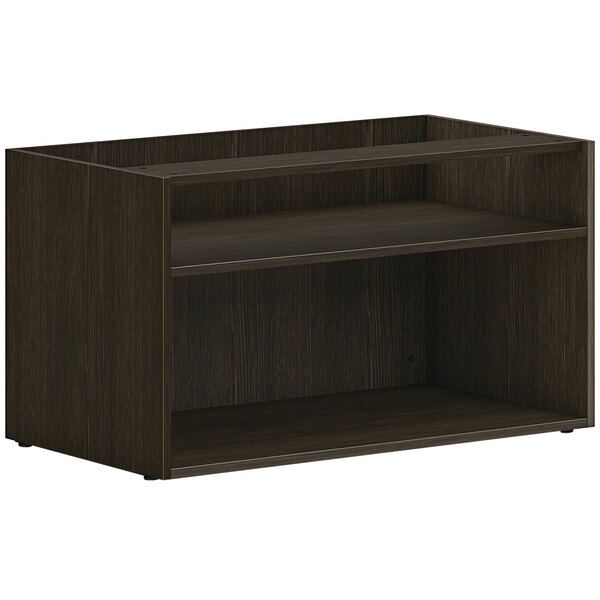 A dark wood HON low open storage credenza shelf with two shelves.