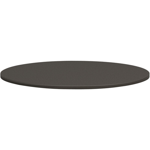 A black round HON conference table top.