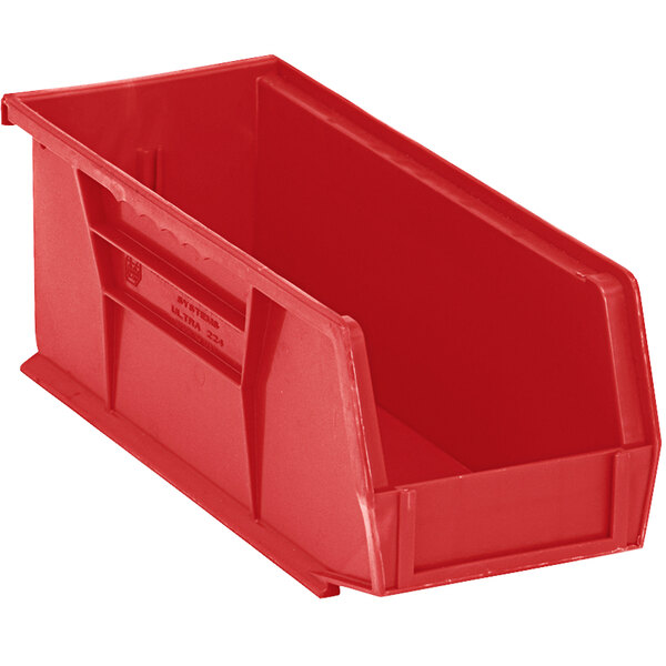 A red plastic Quantum hanging bin with a handle.