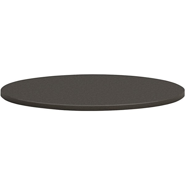 A black round HON conference table top.