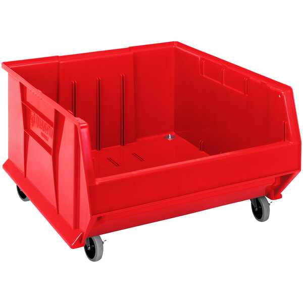 A Quantum red plastic storage bin with wheels.