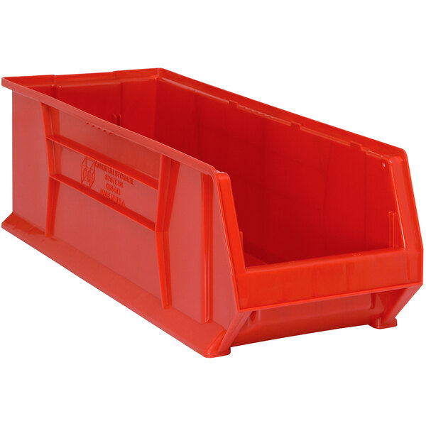 A Quantum red plastic bin with a handle.