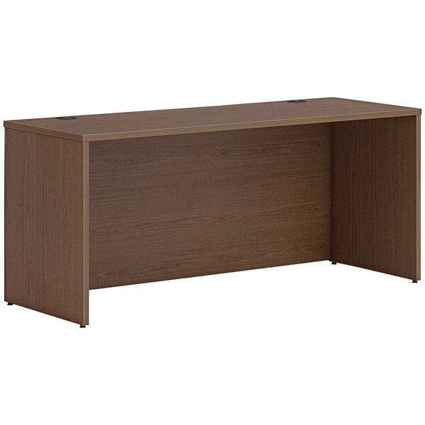 A brown HON credenza shell with a wooden top.